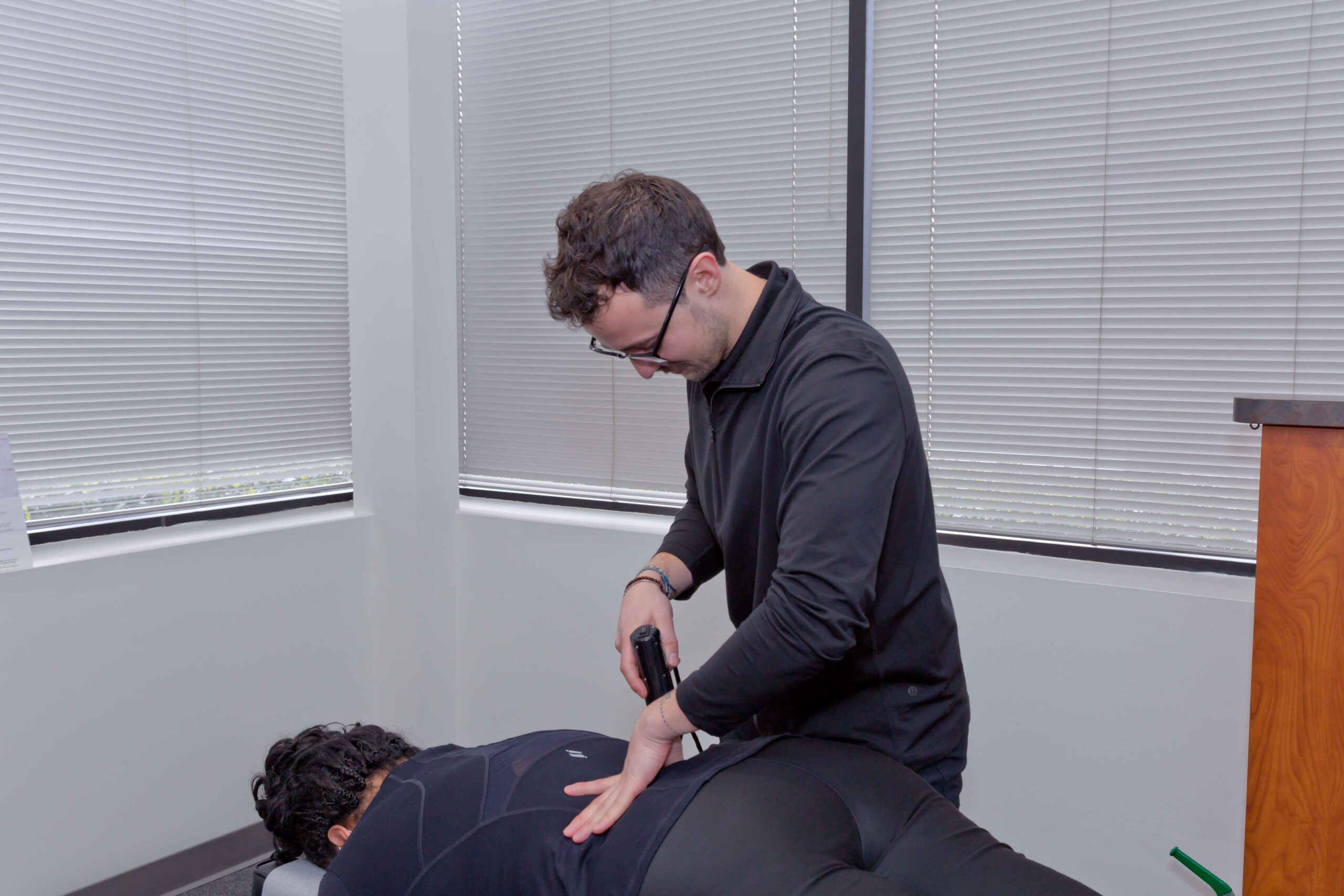 Dr. Connor Reed giving patient arhrostim technique for pinched nerve