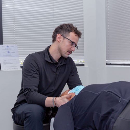 Dr. Connor Reed giving patient headache treatment relief